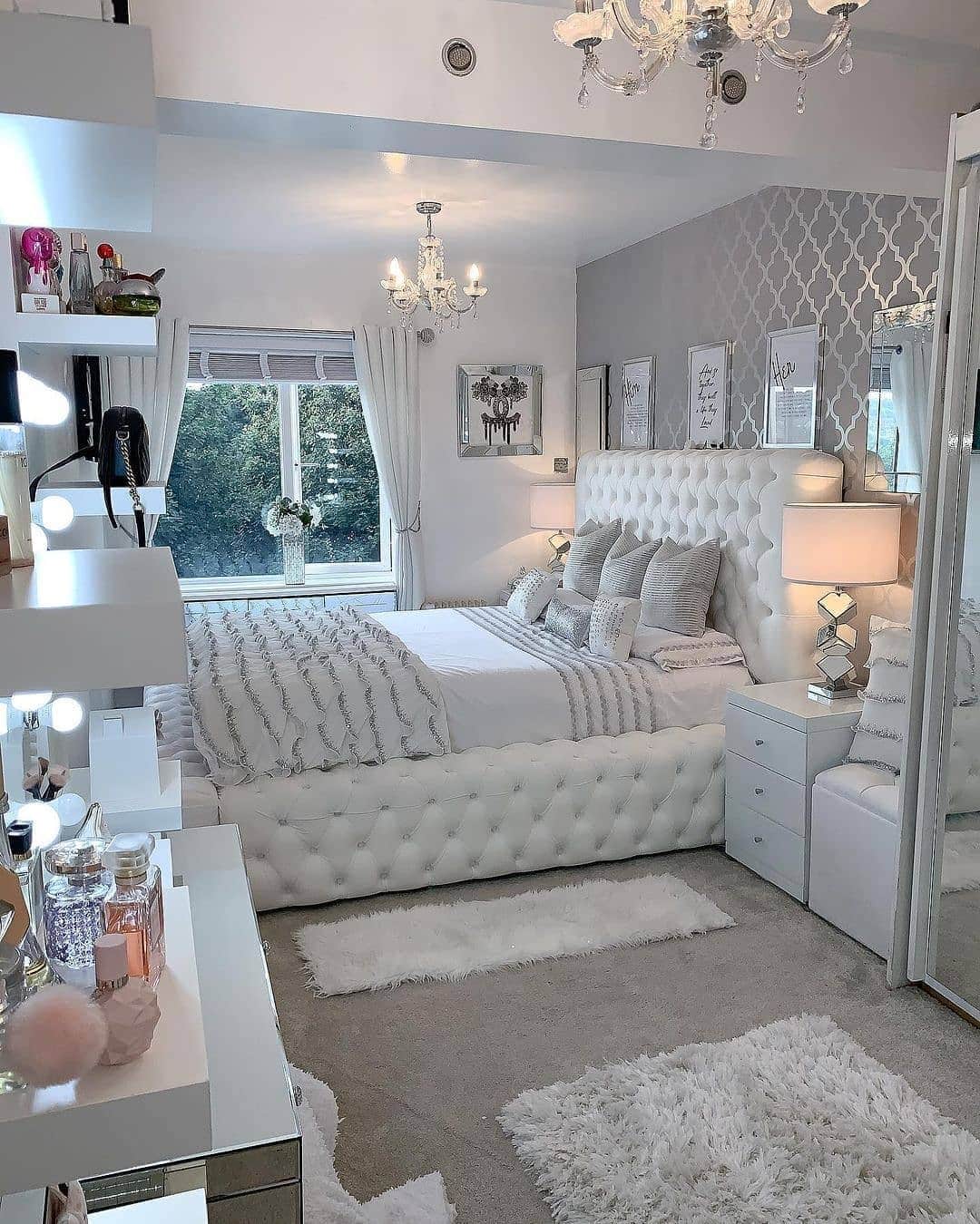 8. Glam White Bedroom with Tufted Bed and Vanity Area - white bedroom ideas