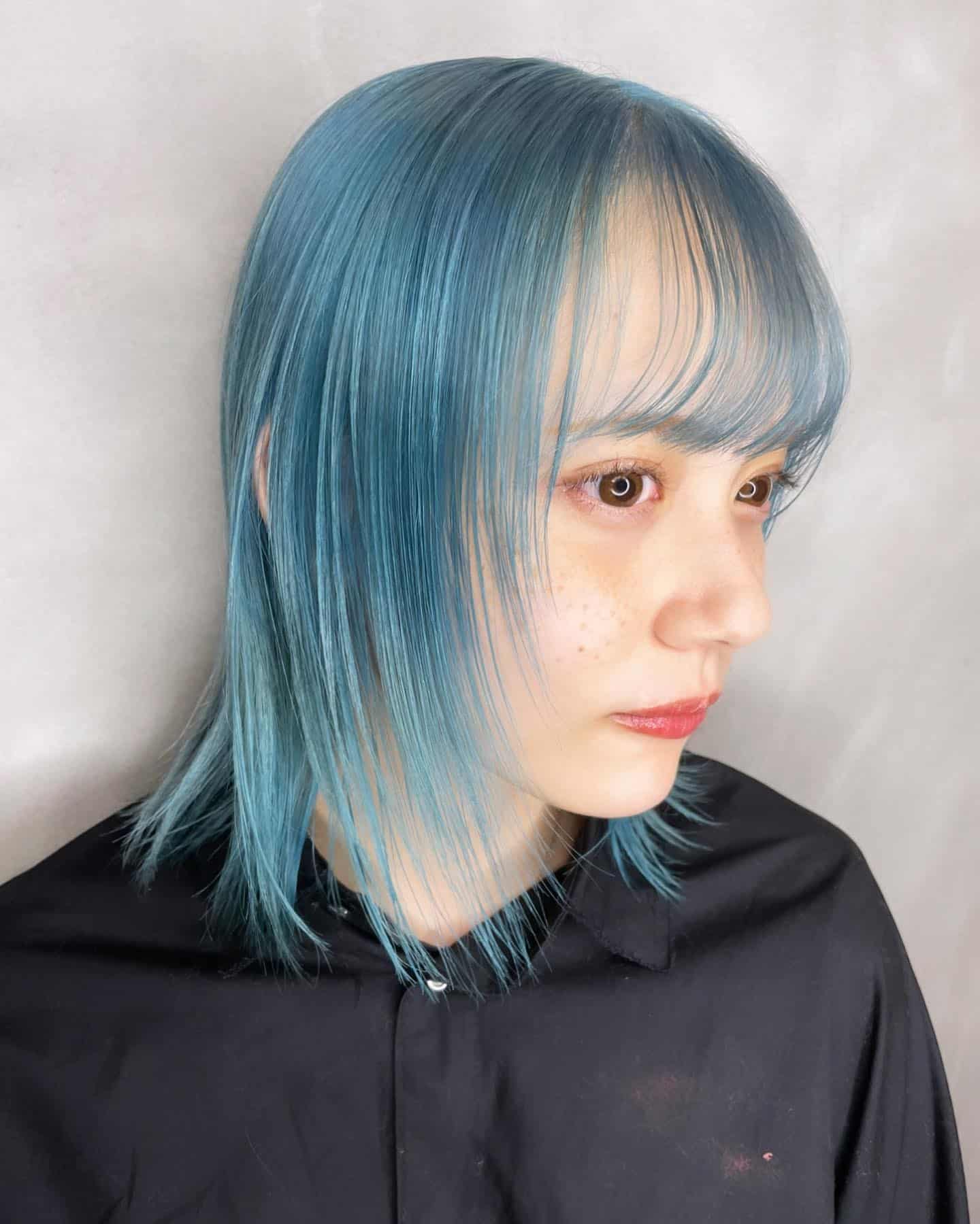 4. Soft Powder Blue Layered Shag - Light Blue Hair Color
