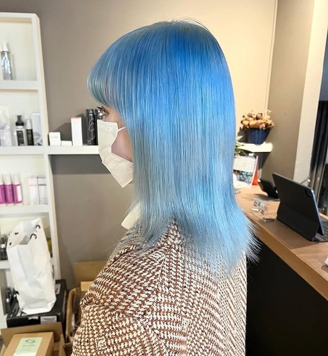 8. Pastel Sky Blue Straight Cut with Bangs - Light Blue Hair Color