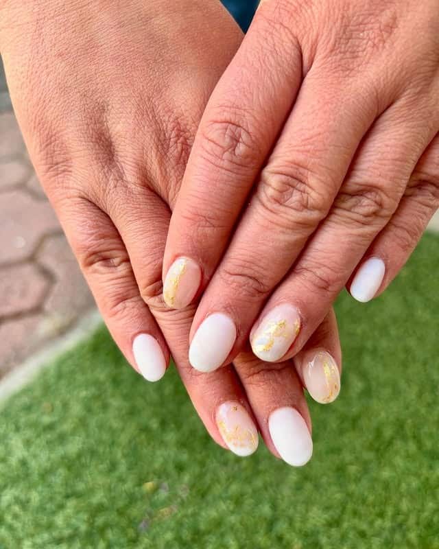 5. Matte Off White Almond Nails with Gold Foil Accents - off white nail ideas