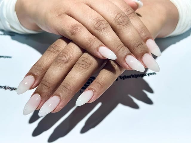 8. Glossy Off White Almond Nails with Sheer Milky Finish - off white nail ideas