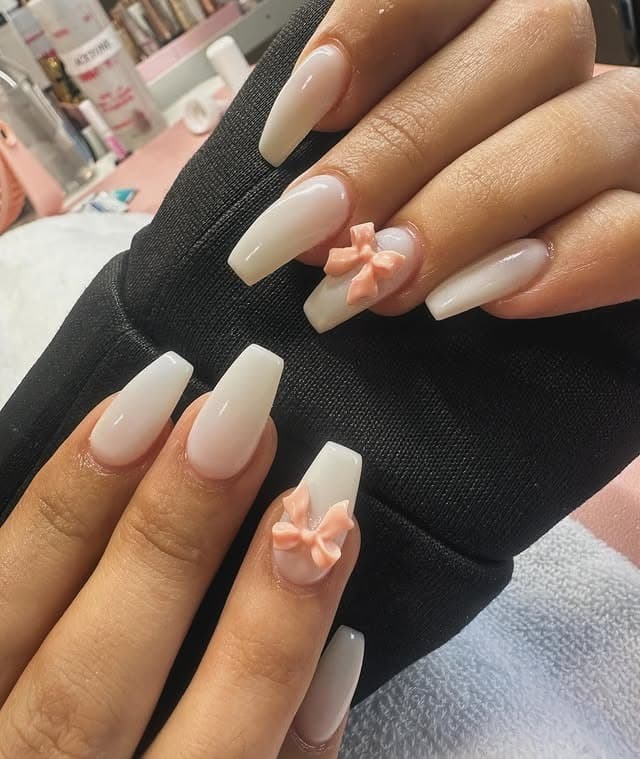 12. Milky Off White Coffin Nails with 3D Peach Bow Accents - off white nail ideas