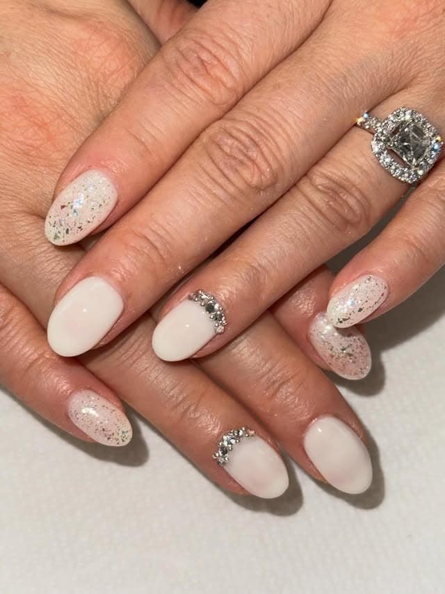 14. Off White Almond Nails with Crystal Cuticle Accents and Glitter Details - off white nail ideas