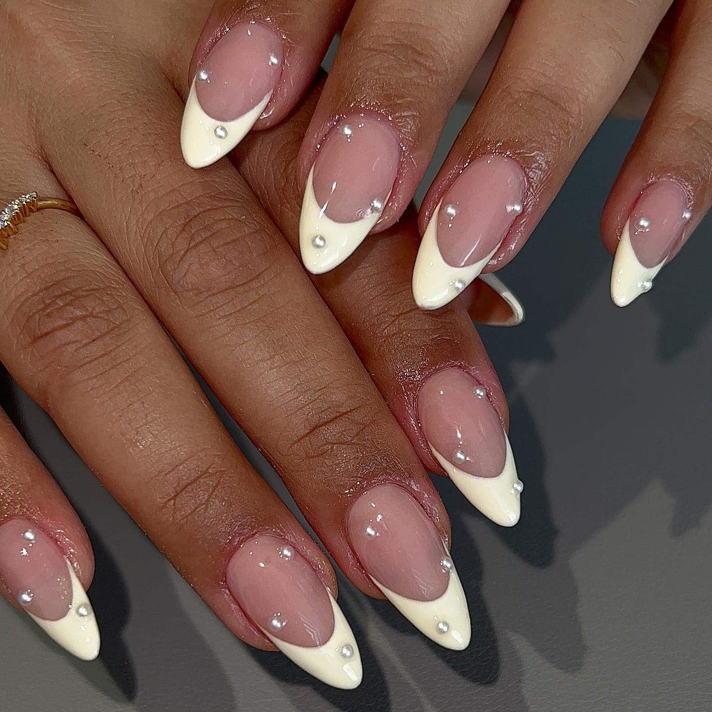 18. Off White V Tip Almond Nails with Pearl Embellishments - off white nail ideas