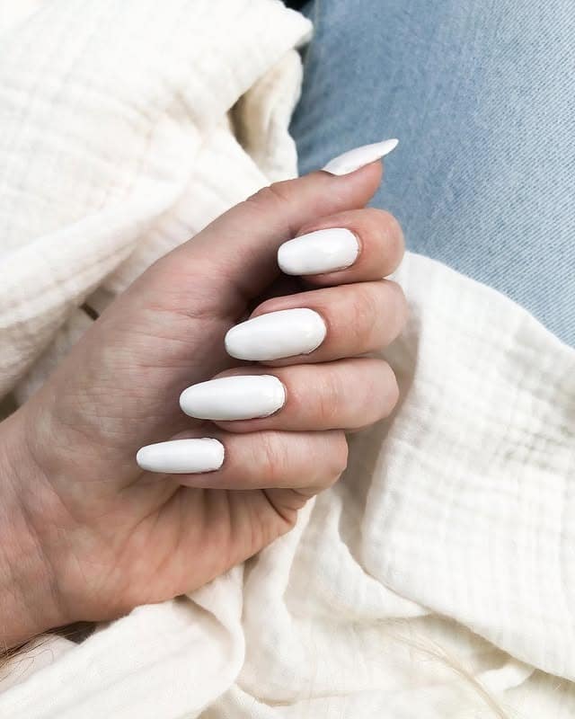19. Glossy Off White Oval Nails with Clean Minimal Finish - off white nail ideas