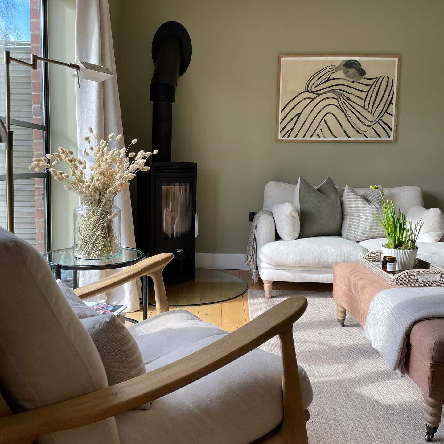 10. Contemporary Country Living Room with Olive Green Walls and Scandinavian Touches - country living room ideas