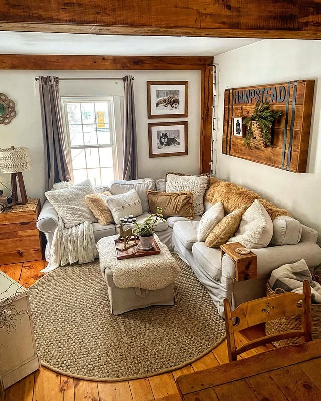 11. Rustic Farmhouse Living Room with Warm Wood and Cream Textiles - country living room ideas