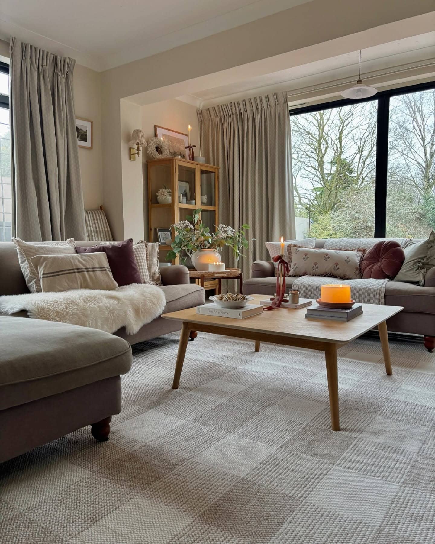 19. Warm Neutral Country Living Room with Natural Light and Candle Decor - country living room ideas