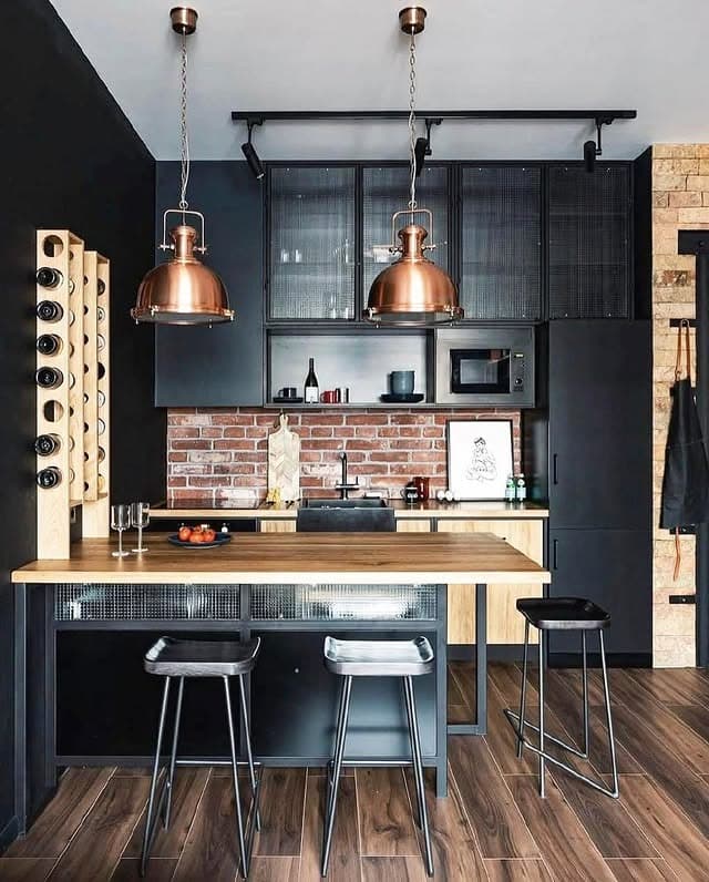 1. Copper Pendant Industrial Kitchen with Charcoal Cabinets and Brick Backsplash - industrial kitchen ideas