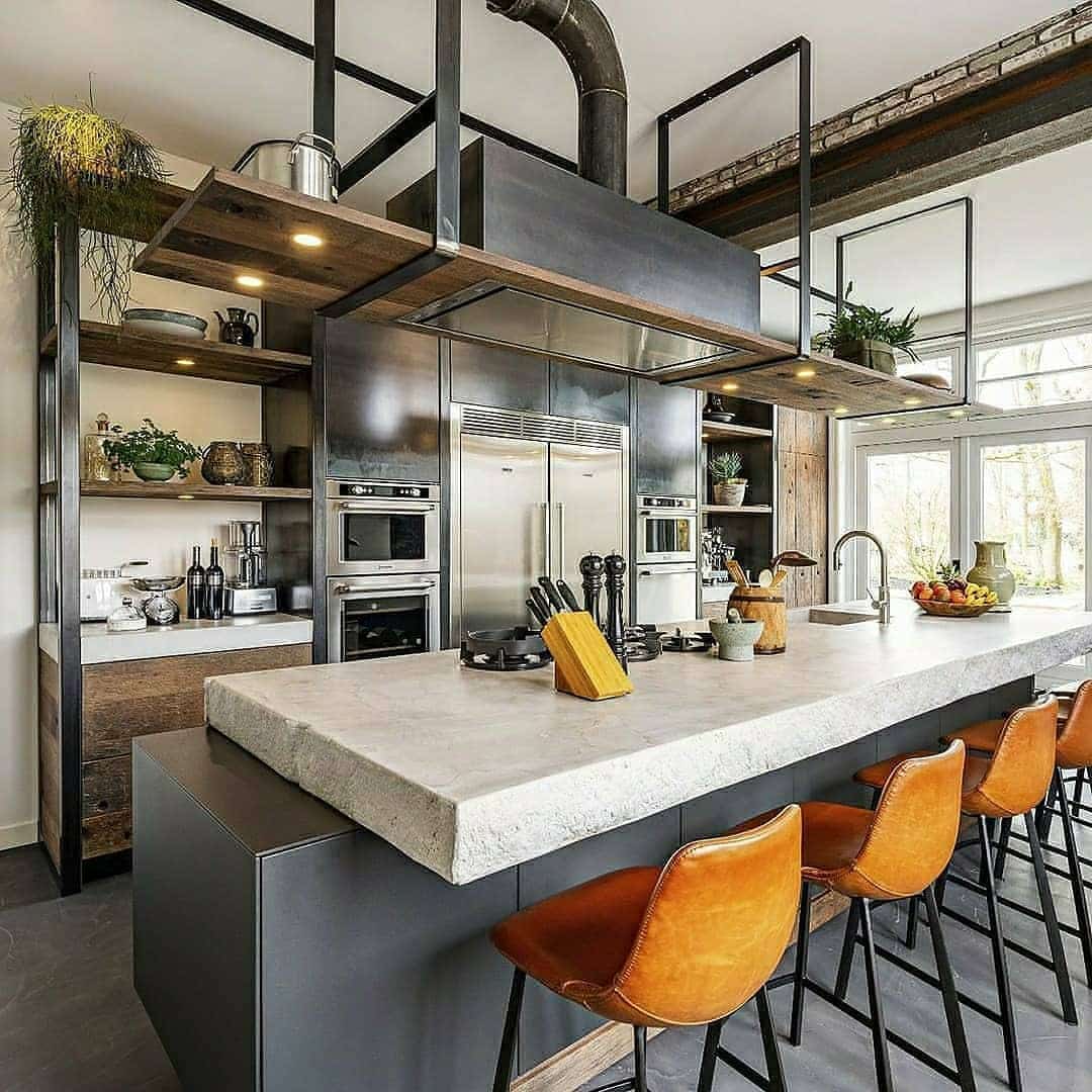5. Industrial Kitchen with Steel Framing and Concrete Countertop Island - industrial kitchen ideas