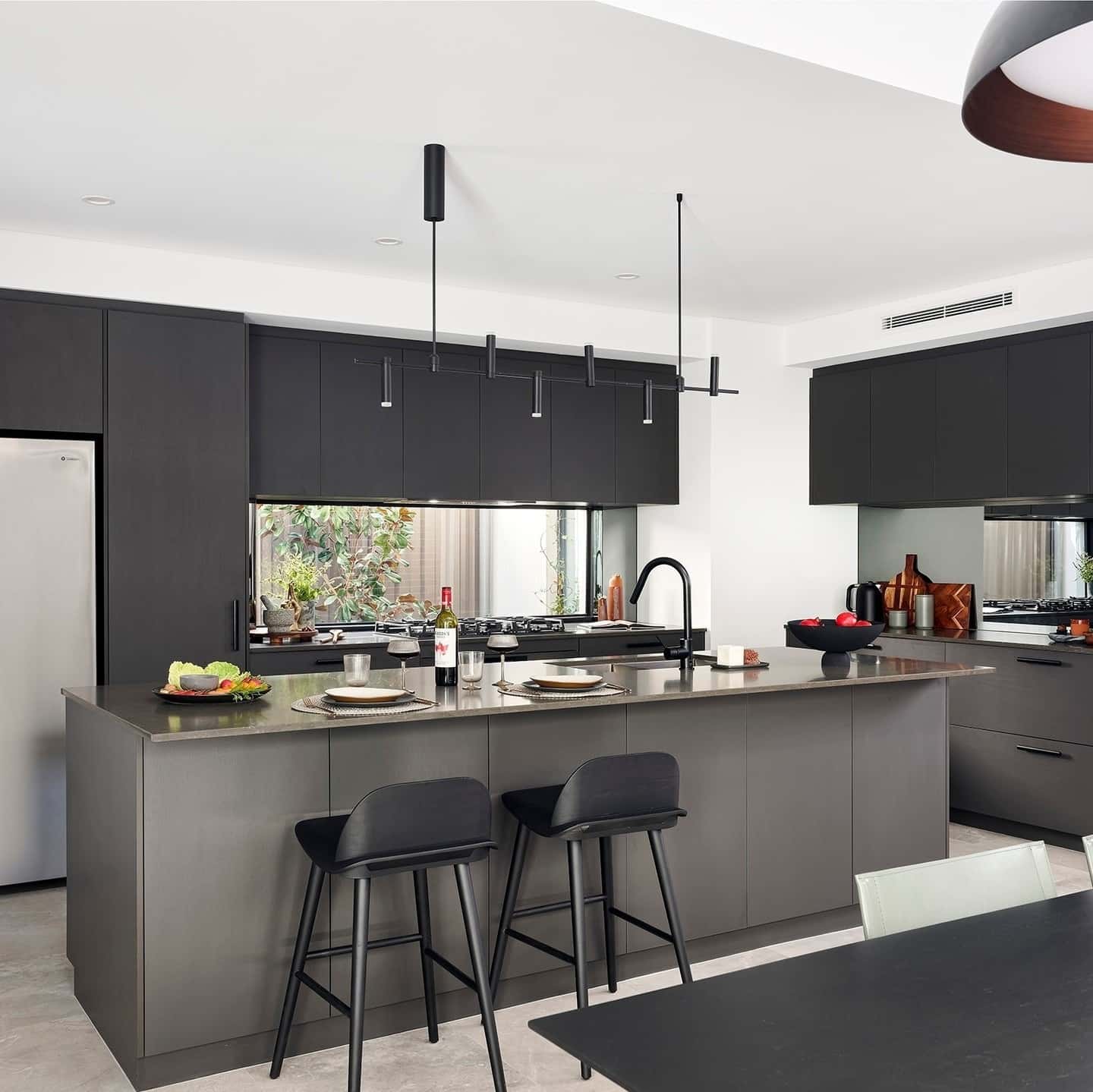 13. Matte Gray Industrial Kitchen with Minimalist Pendant Lighting - industrial kitchen ideas