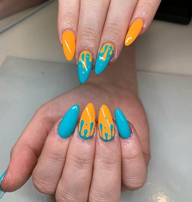 3. Almond Orange and Blue Drip Accent Nails - orange and blue nail ideas