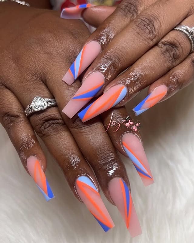 5. Long Tapered Nude Nails with Orange and Blue Diagonal Lines - orange and blue nail ideas
