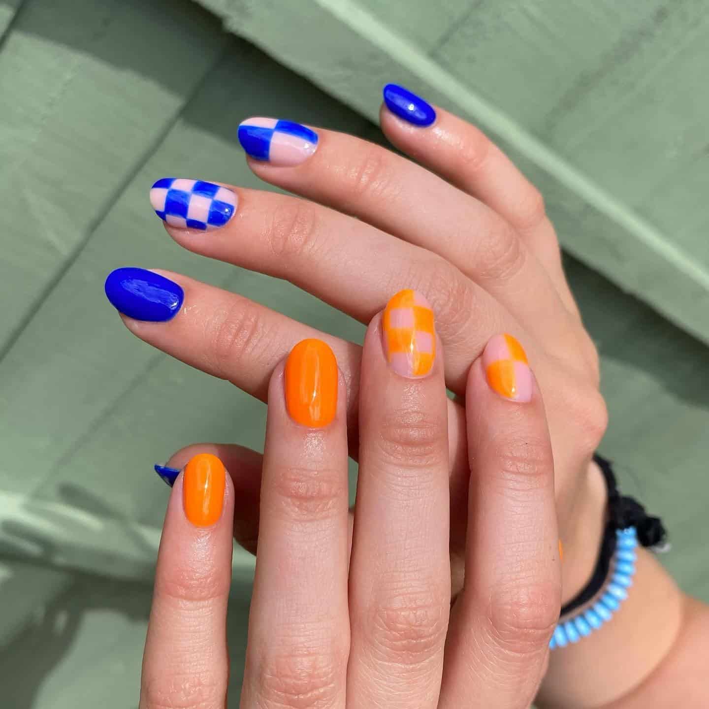 7. Almond Blue and Orange Checkerboard Accent Nails - orange and blue nail ideas