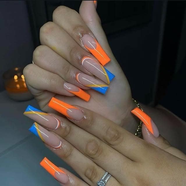 19. Long Coffin Nude Nails with Orange and Blue Geometric Tips - orange and blue nail ideas