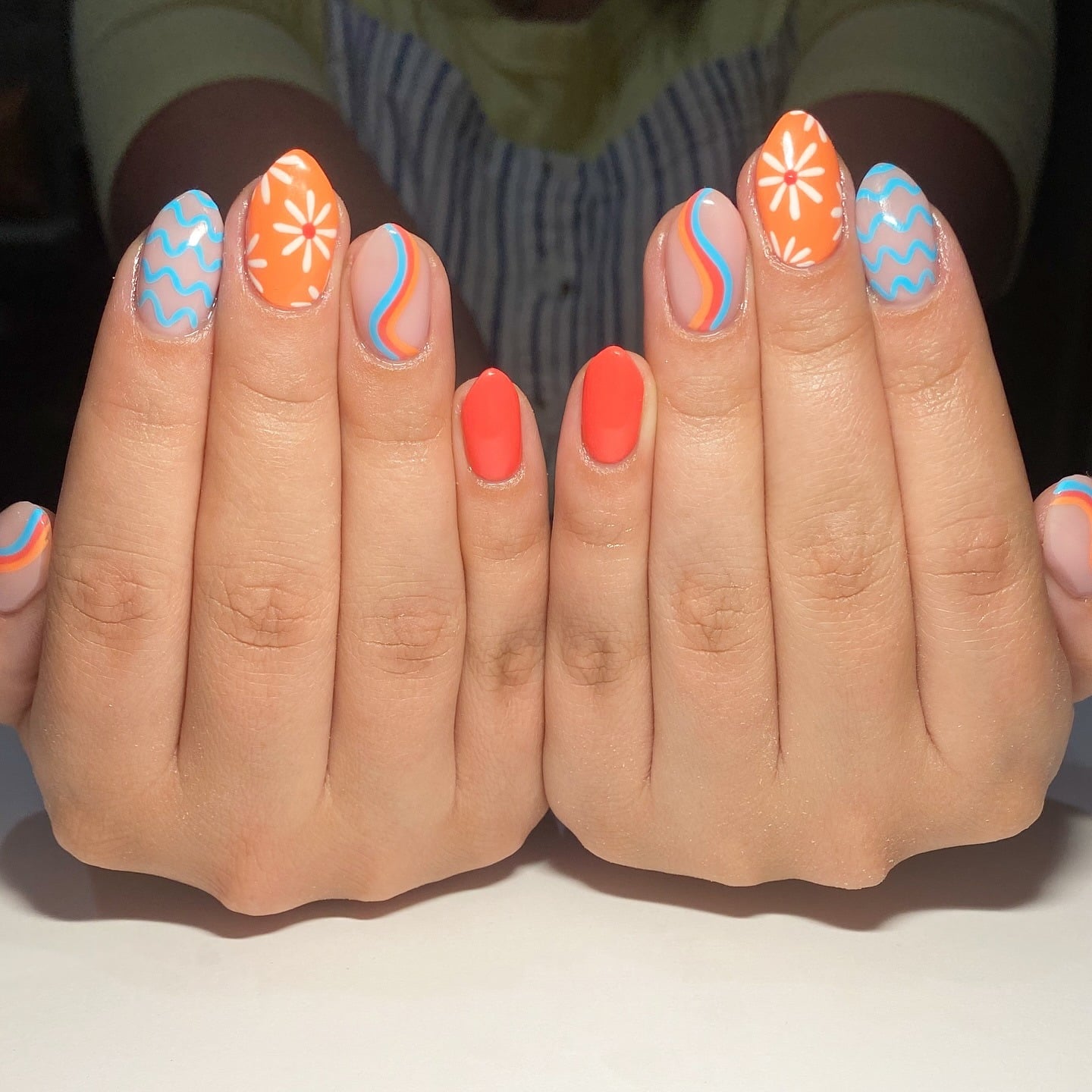21. Almond Orange and Blue Retro Daisy and Wave Nails - orange and blue nail ideas