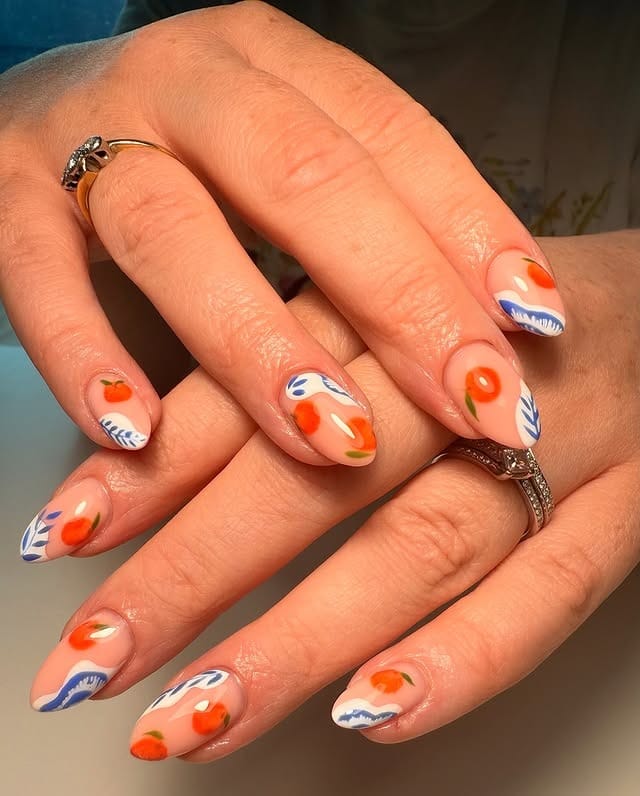 22. Short Almond Nude Nails with Orange Fruit and Blue Botanical Art - orange and blue nail ideas