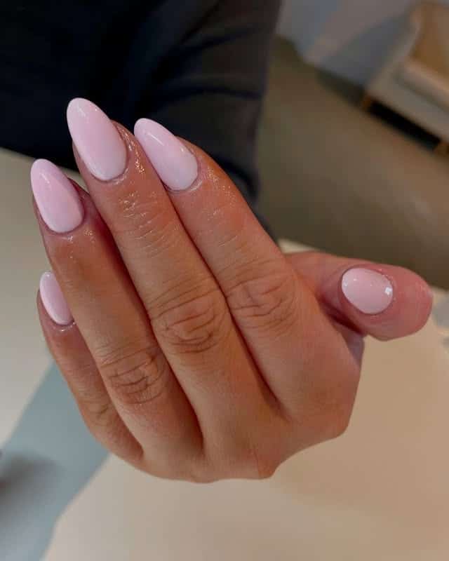 11. Glossy Pastel Pink Almond Gel Nails - pastel pink nail ideas