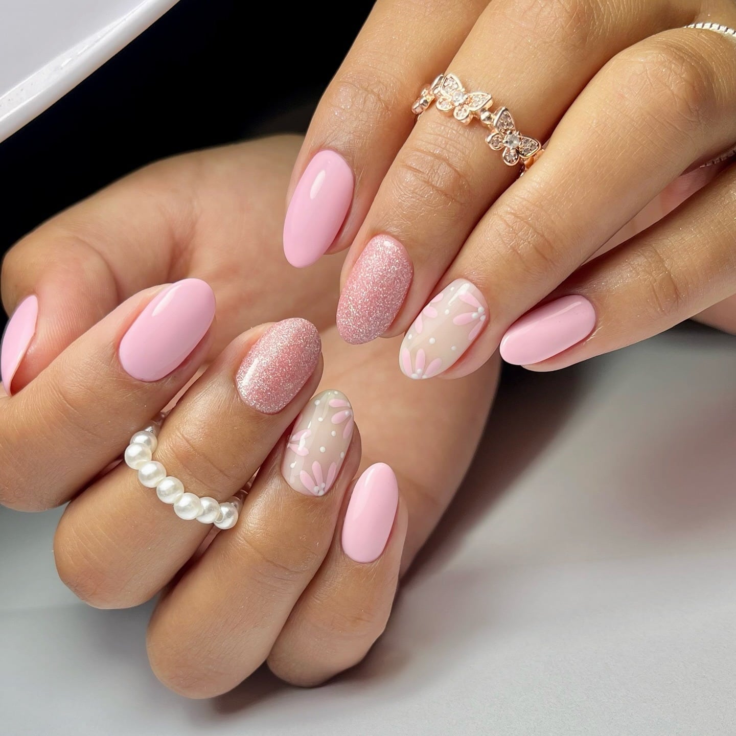 20. Pastel Pink Floral Accent Almond Nails with Glitter - pastel pink nail ideas