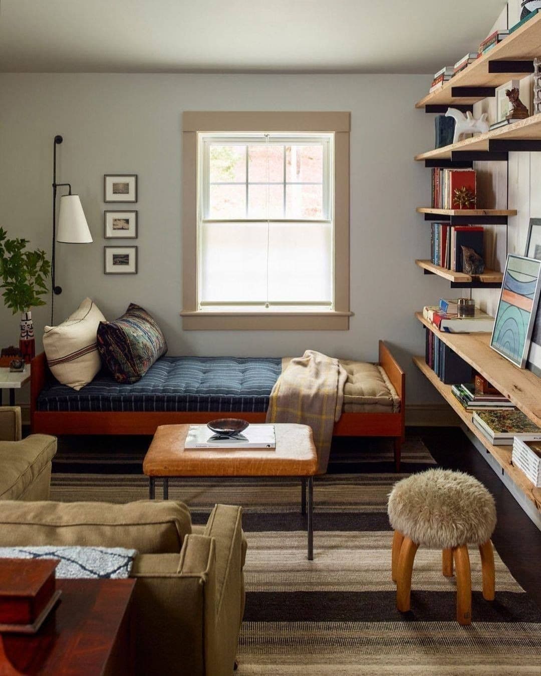 9. Cozy Single Bed Bedroom Office With Wall Shelving - home office bedroom ideas