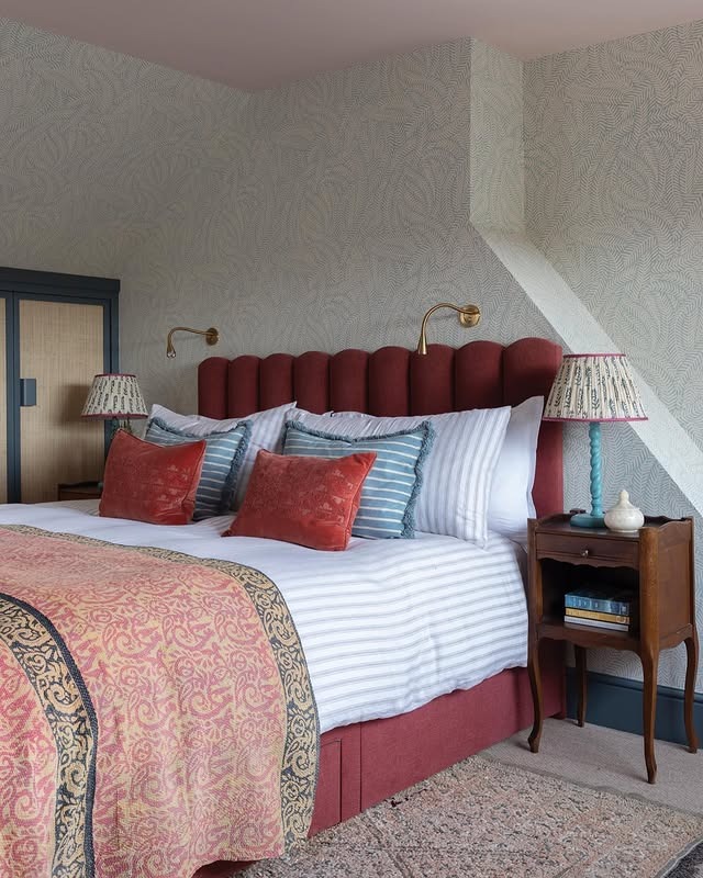 11. Burgundy and Blue Traditional Loft Bedroom with Patterned Textiles - loft bedroom ideas