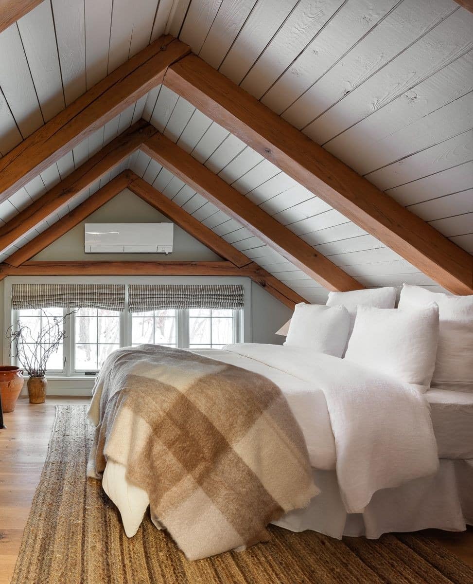 15. Rustic Loft Bedroom with Exposed Wood Beams and Neutral Bedding - loft bedroom ideas
