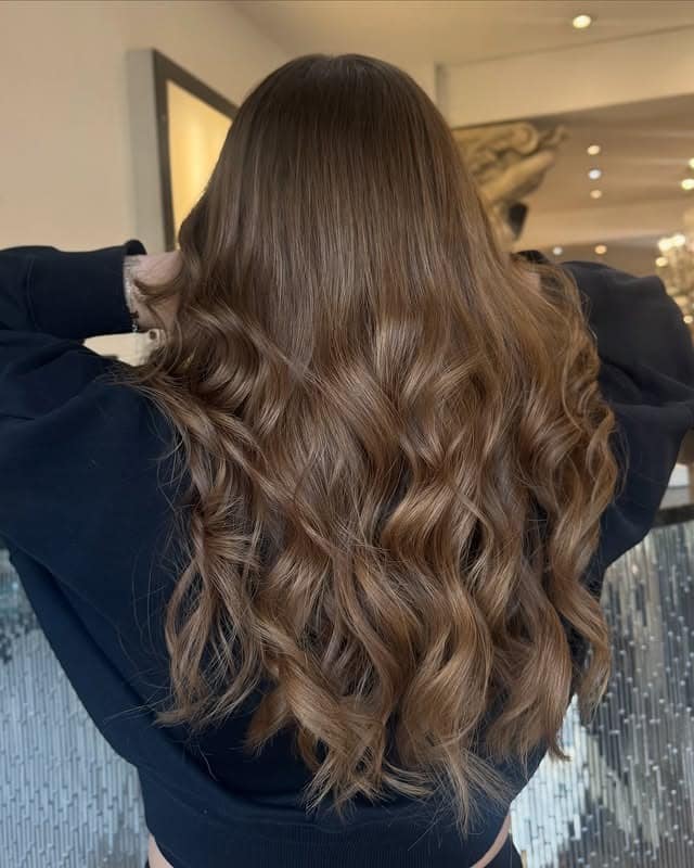 10. Golden Brunette Long Waves - Brunette Hair Color