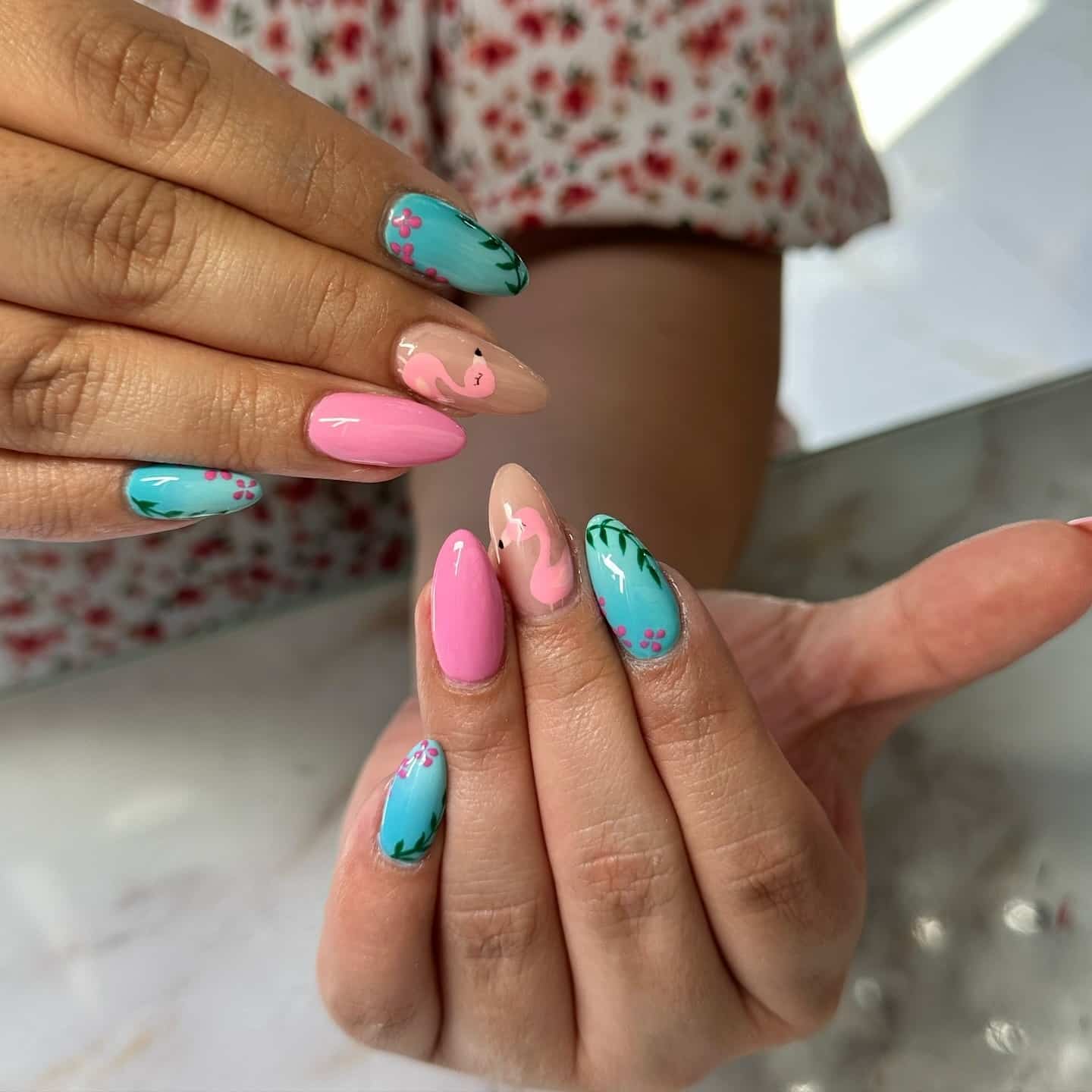 21. Pink and Teal Flamingo Almond Nails with Floral Accents - pink and teal nail ideas