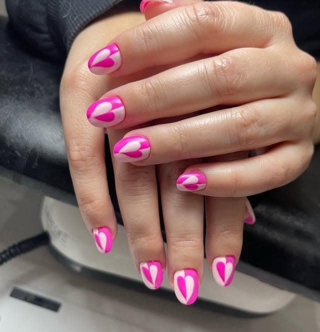 7. Short Pink Nails with White Heart Cutout Design - pink heart nail ideas