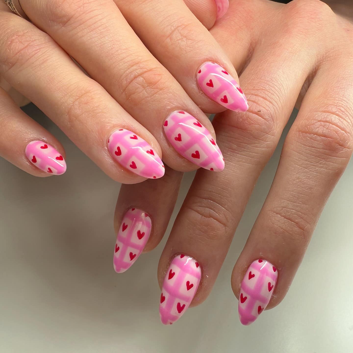 11. Pink Plaid Almond Nails with Red Heart Details - pink heart nail ideas