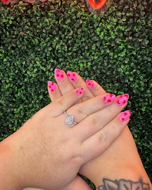 13. Bright Pink Short Nails with Tiny Red Heart Accents - pink heart nail ideas
