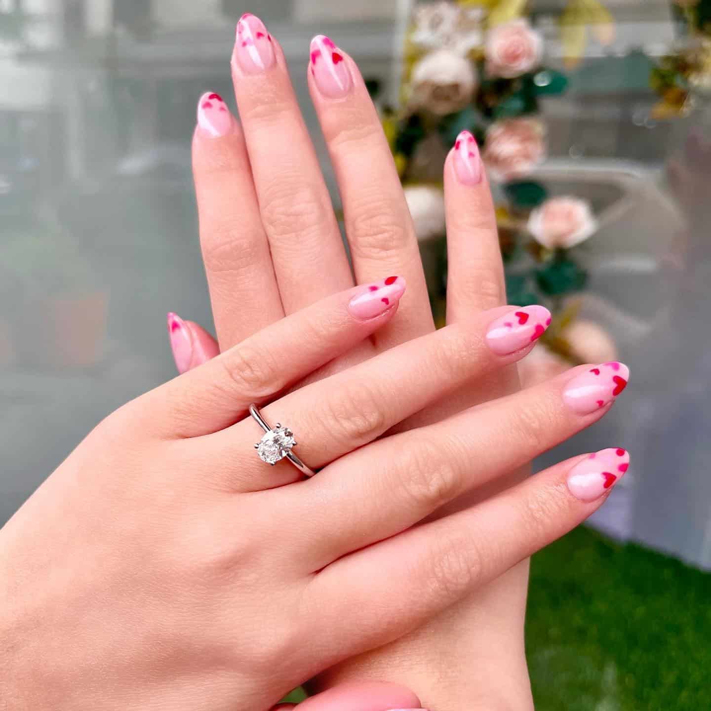 14. Soft Pink Almond Nails with Delicate Heart Tips - pink heart nail ideas