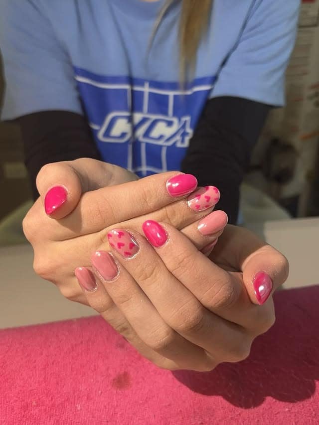 18. Mixed Pink Short Nails with Polka Dot Heart Accent - pink heart nail ideas