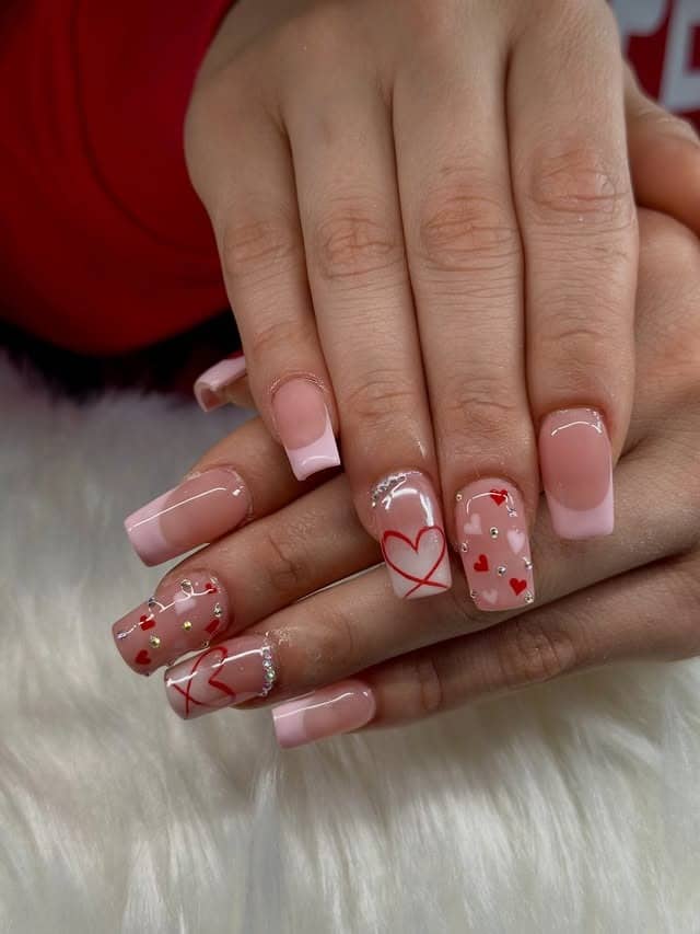 20. Nude Pink Square Nails with French Tips, Hearts, and Rhinestones - pink heart nail ideas