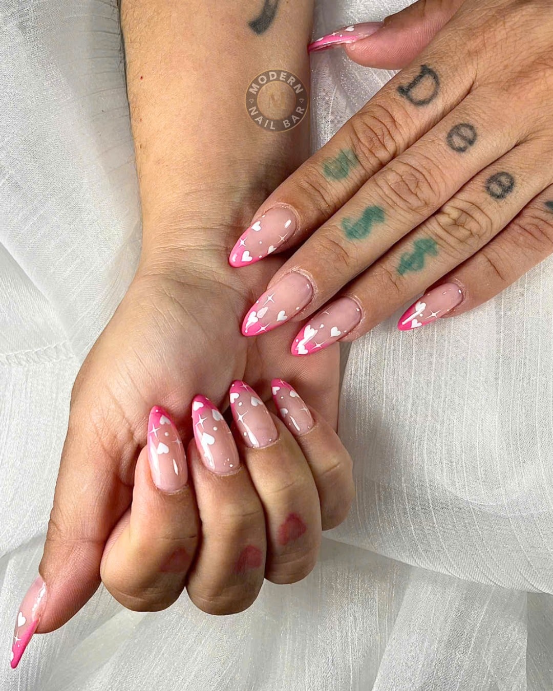 21. Pink French Tip Almond Nails with White Heart and Sparkle Details - pink heart nail ideas