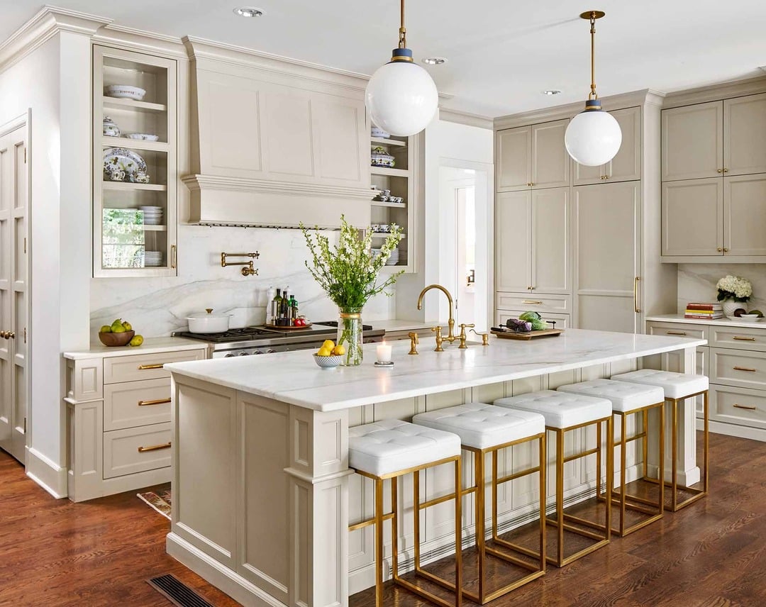 3. Classic Cream Kitchen With Marble Island and Gold Accents - cream kitchen ideas
