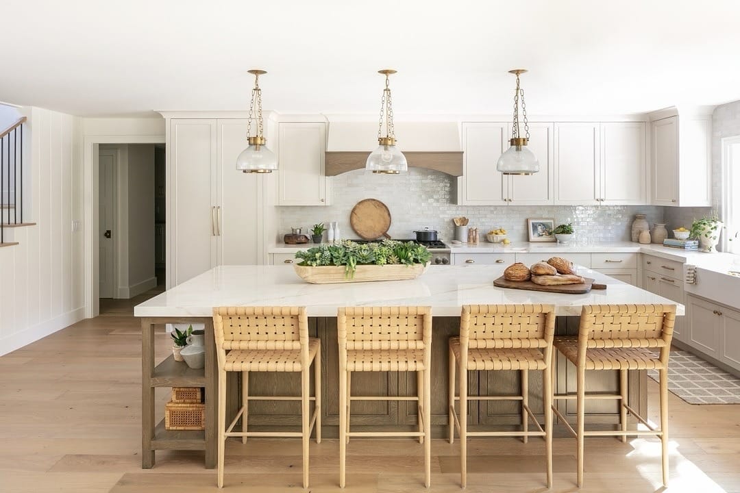 4. Cream Kitchen With Light Wood Island and Woven Bar Stools - cream kitchen ideas