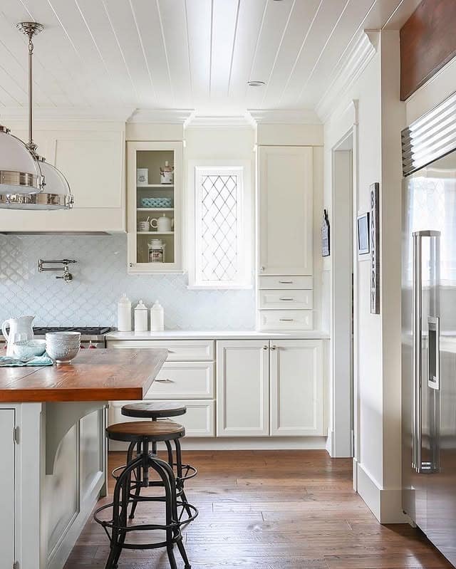 8. Cottage Style Cream Kitchen With Wood Countertops - cream kitchen ideas