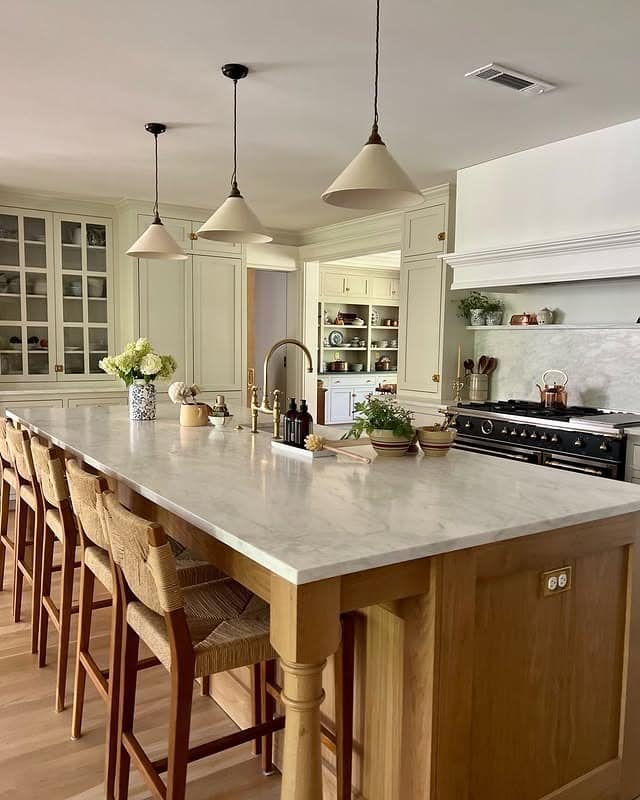 9. Traditional Cream Kitchen With Marble Countertop and Wood Island - cream kitchen ideas