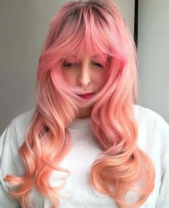 6. Peach Pastel Long Layered Hair with Fringe - Pastel Hair Colors