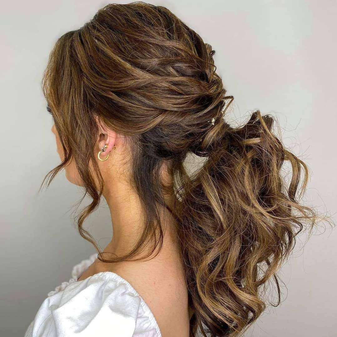 4. Voluminous Twisted Ponytail with Caramel Highlighted Brunette - Ponytail Hairstyles