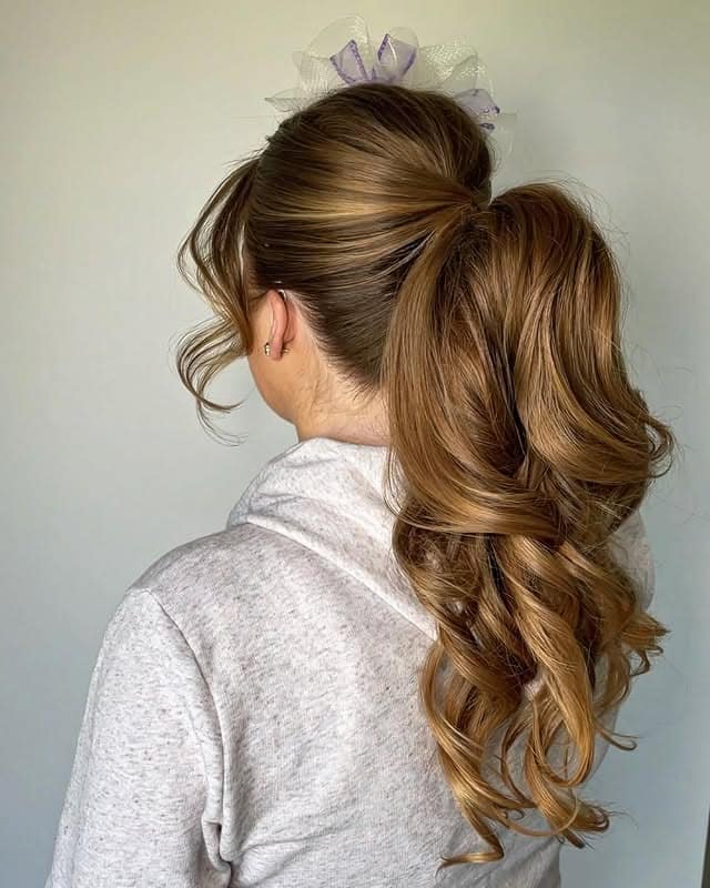 6. Elegant Curled Ponytail with Warm Golden Brown - Ponytail Hairstyles