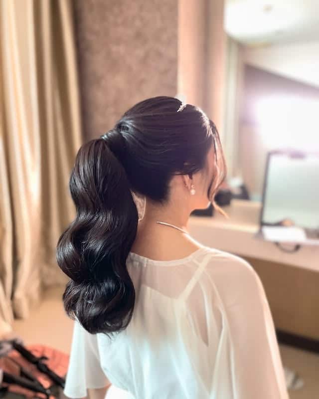 8. Low Twisted Ponytail with Warm Light Brown Highlights - Ponytail Hairstyles