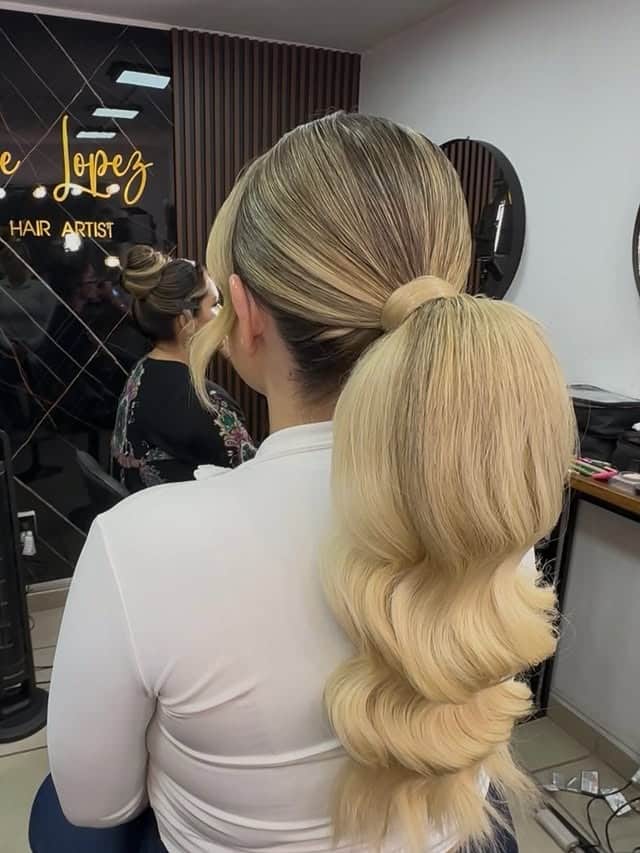 11. Sleek Low Ponytail with Creamy Platinum Blonde Waves - Ponytail Hairstyles