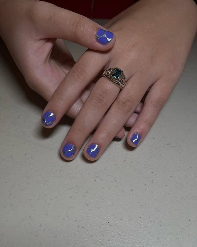 4. Deep Purple Short Nails with Silver Line Art - purple and silver nail ideas