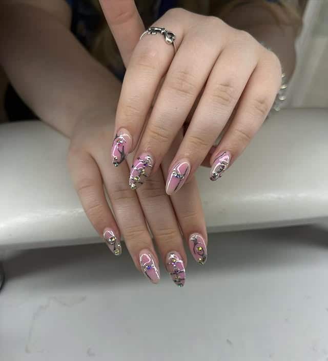 8. Pink and Purple Rhinestone Nails with Silver Details - purple and silver nail ideas