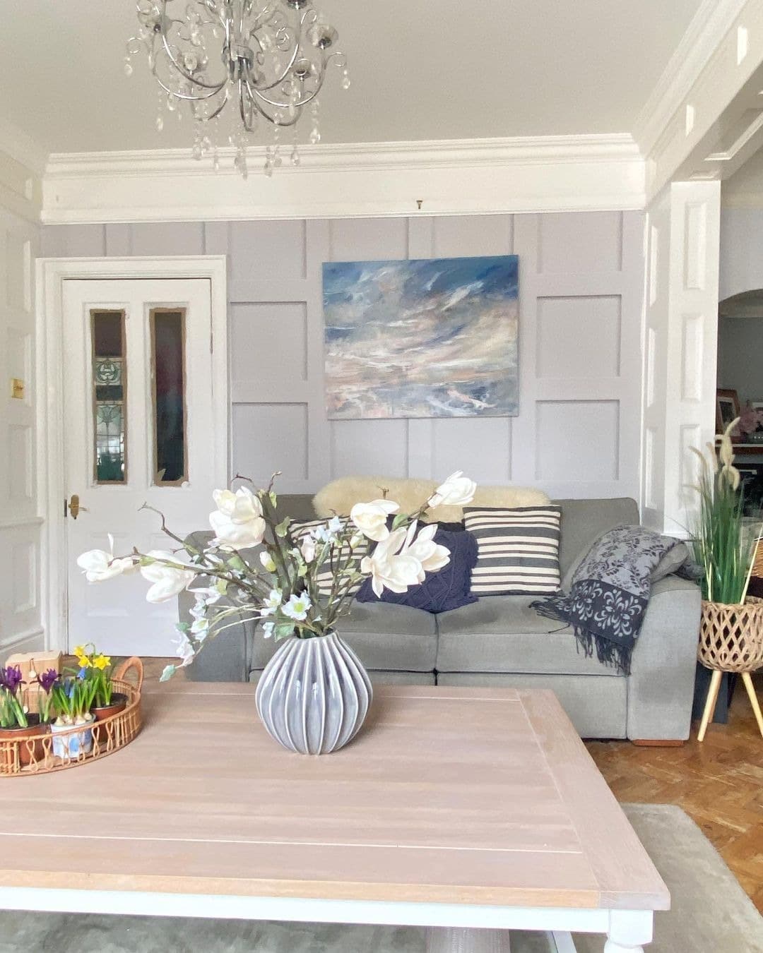 7. Light Gray Living Room with Decorative Panel Walls - light gray living room ideas