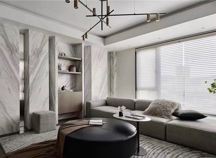 9. Minimalist Light Gray Living Room with Marble Details - light gray living room ideas