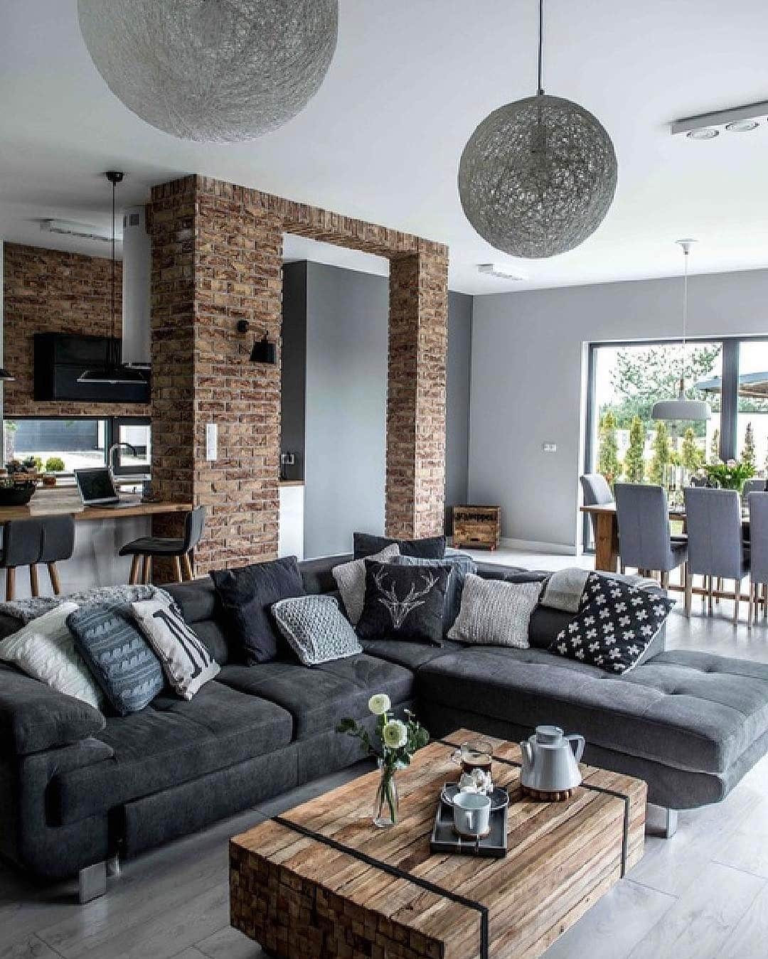 12. Industrial Light Gray Living Room with Exposed Brick - light gray living room ideas