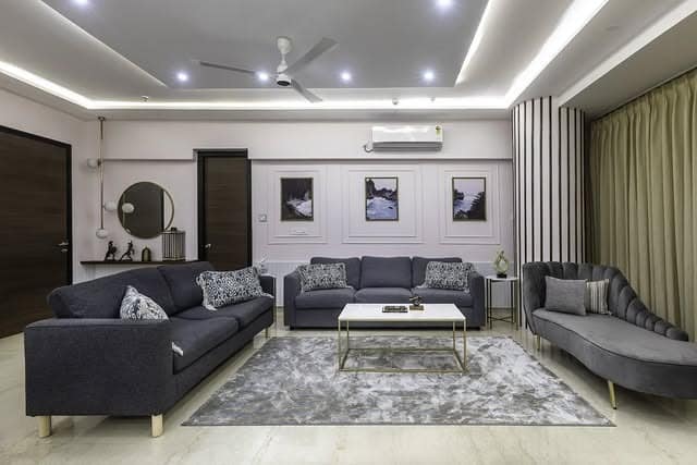 17. Contemporary Light Gray Living Room with Recessed Lighting - light gray living room ideas